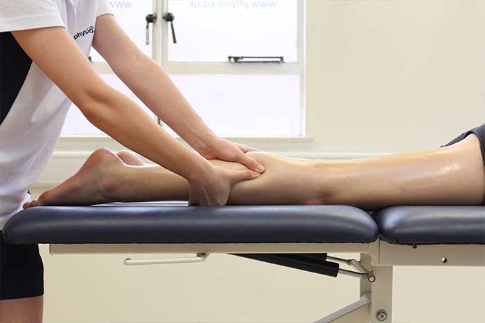 Massage Effleurage Back Treatment Therapist performing Massage Effleurage strokes on a client’s back muscles